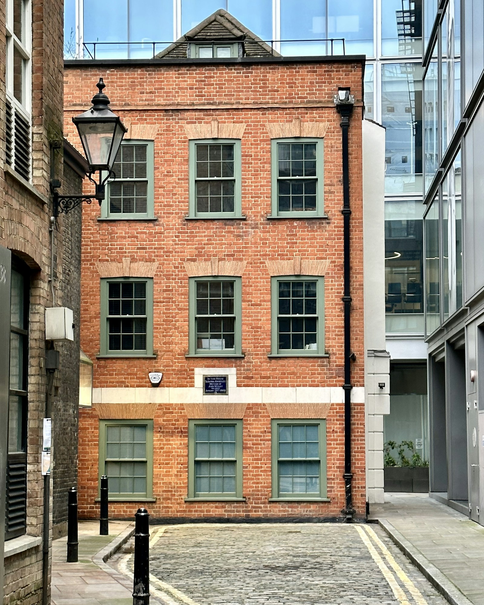Three-storey brick office building on a quiet city street